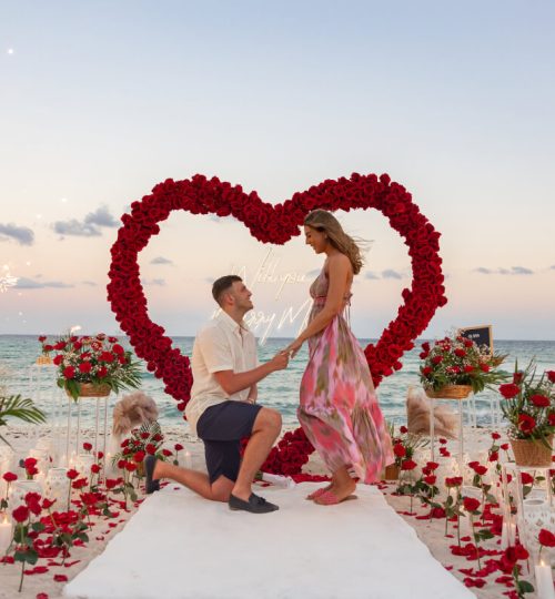 Romantic red rose proposal setup on the beach